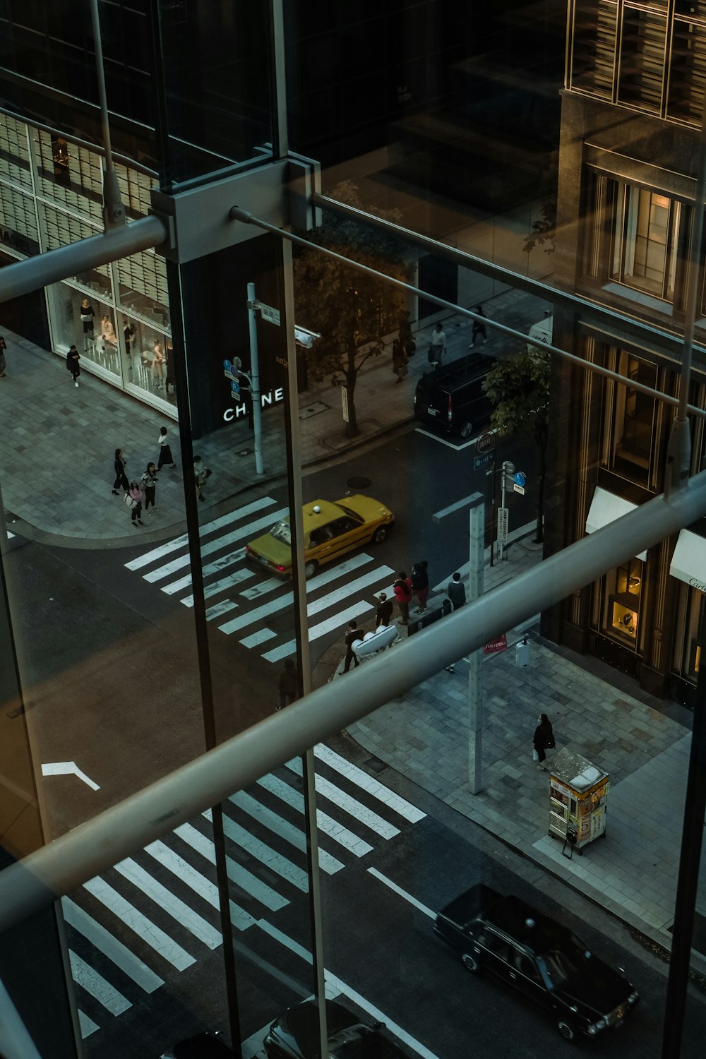 aerial photography of moving taxi cab on pedestrian lane