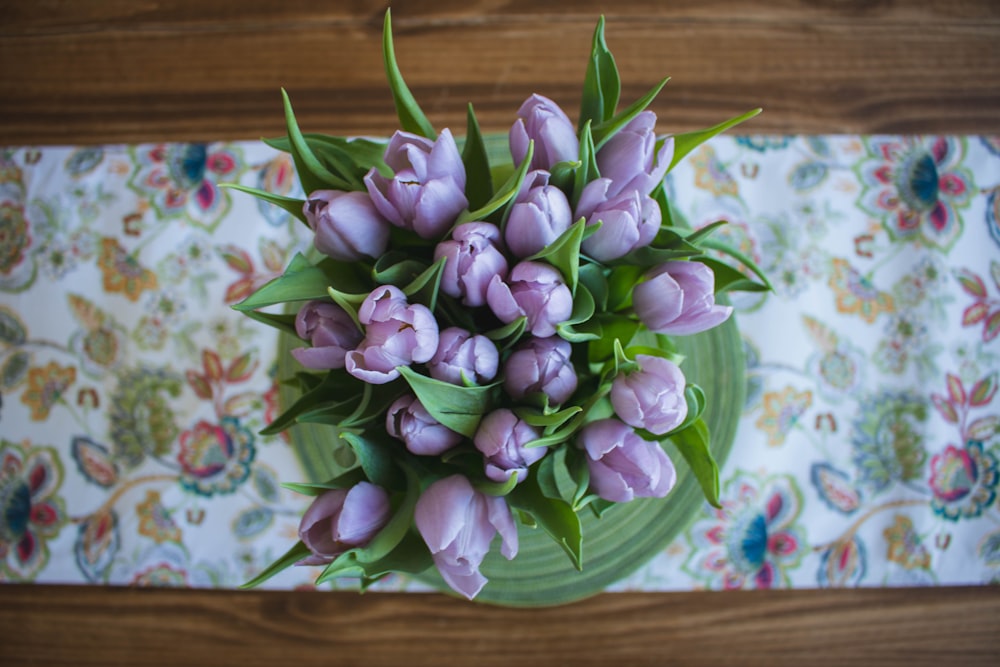 top view photo of purple petaled flowers in vase