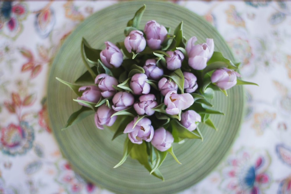 top view photo of purple petaled flowers in vase