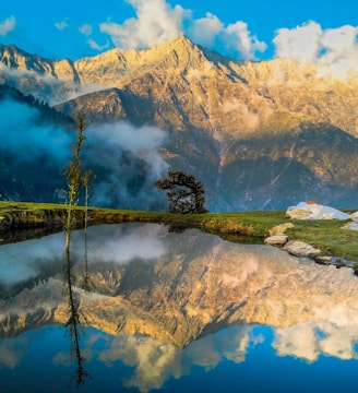 mountain reflecting on body of water