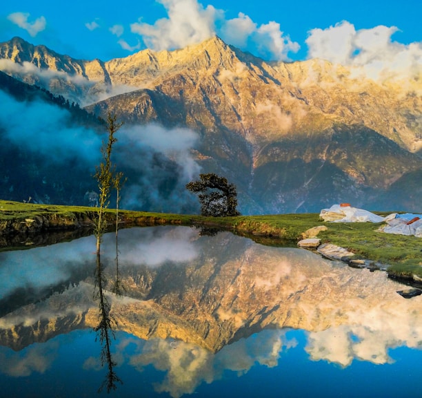 mountain reflecting on body of water