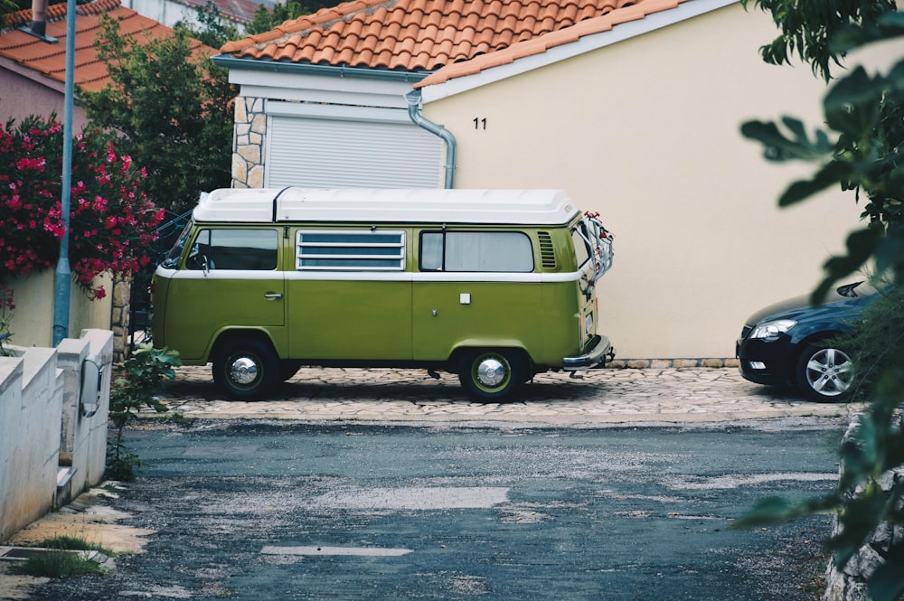 green and white van near house wall