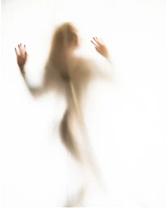 A shadowy figure of a woman holding a baby, surrounded by swirling ghostly shapes and dark forest silhouettes.