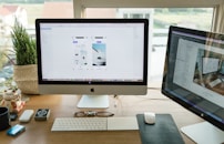 silver iMac with Apple Magic Keyboard and Magic Mouse