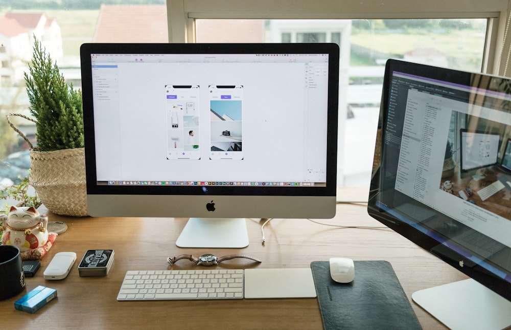 silver iMac with Apple Magic Keyboard and Magic Mouse