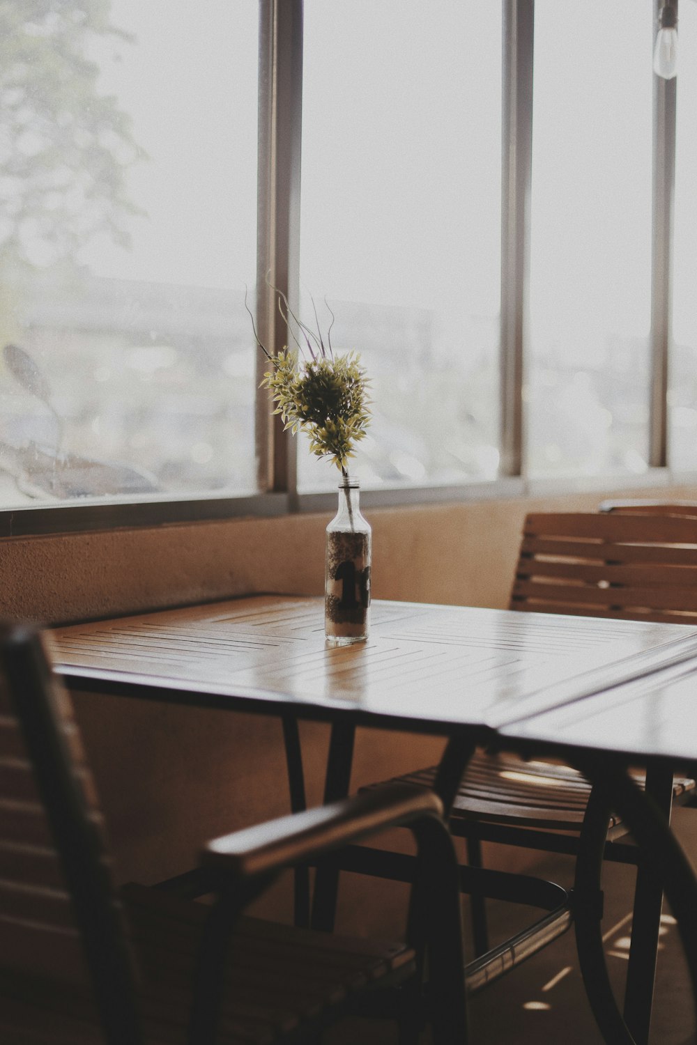 clear glass bottle top of table