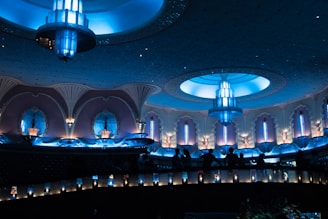 lighted hall with large light fixtures mounted on ceiling