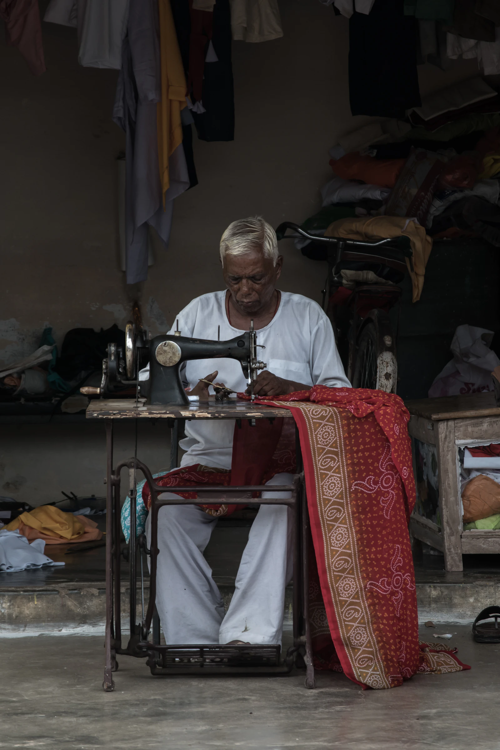 A person working at a sewing machine