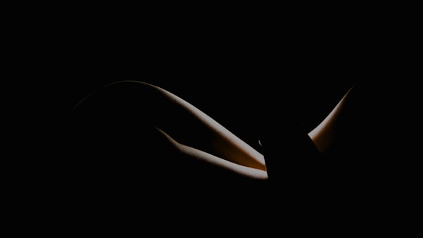 Elegant black background with a subtle spotlight highlighting a premium photo print from the collection.