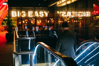 man going down to escalator