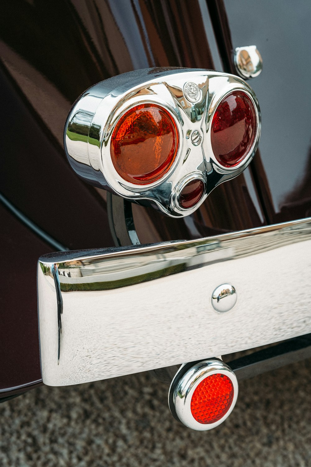 a close up of the tail light of a classic car