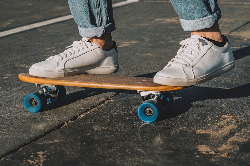 person riding skateboard on road