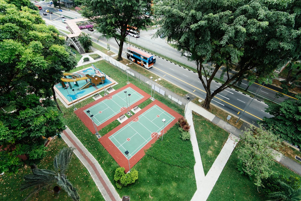 bird's eye view photo of two empty tennis fields