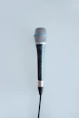 A friendly journalist holding a microphone, ready to connect.