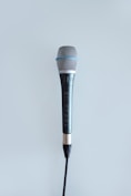 black and gray corded microphone