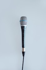 A radio microphone with the Athens County Cares logo, symbolizing connection through the local broadcast.