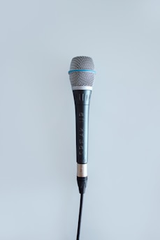 black and gray corded microphone