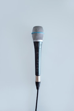 black and gray corded microphone