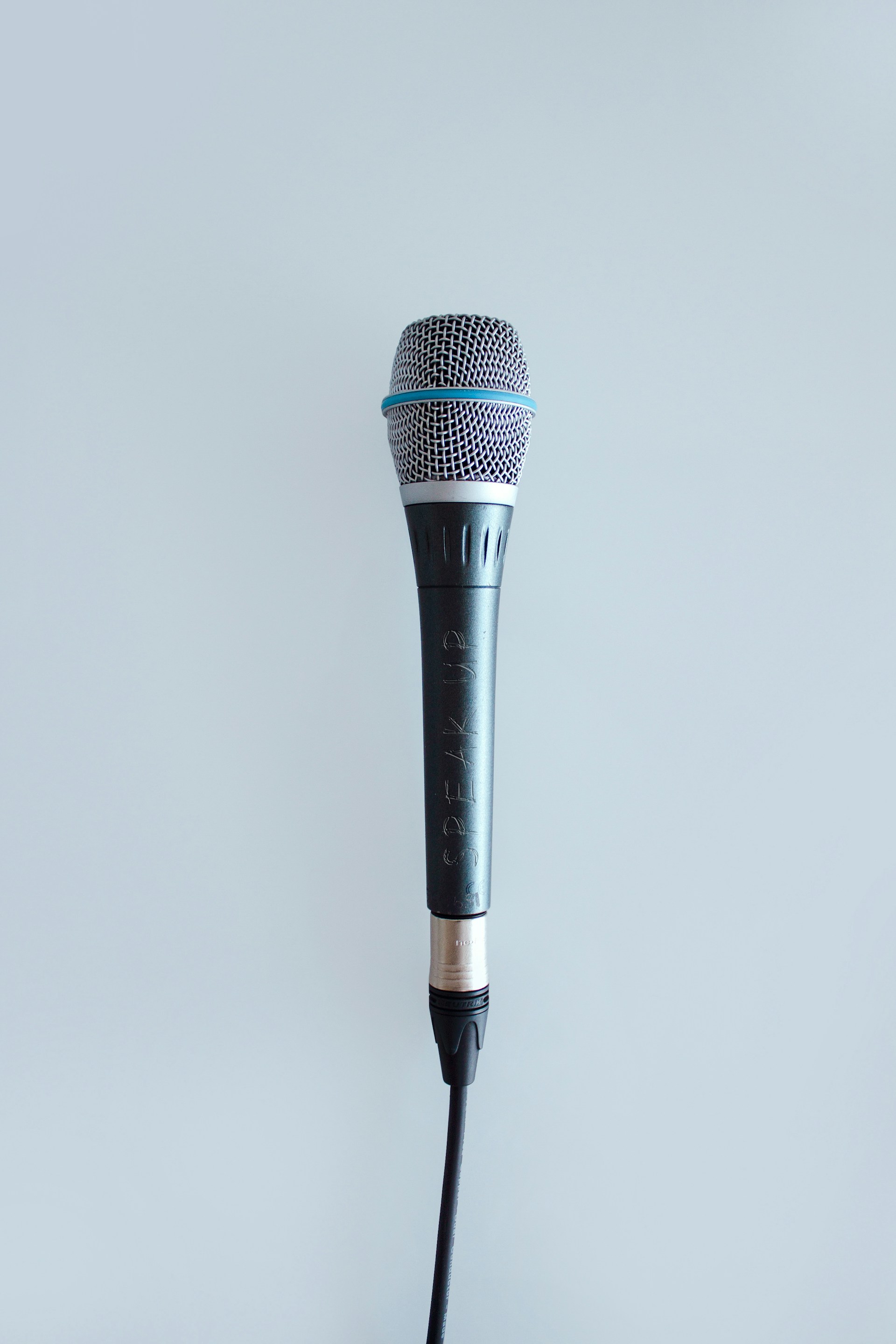 black and gray corded microphone