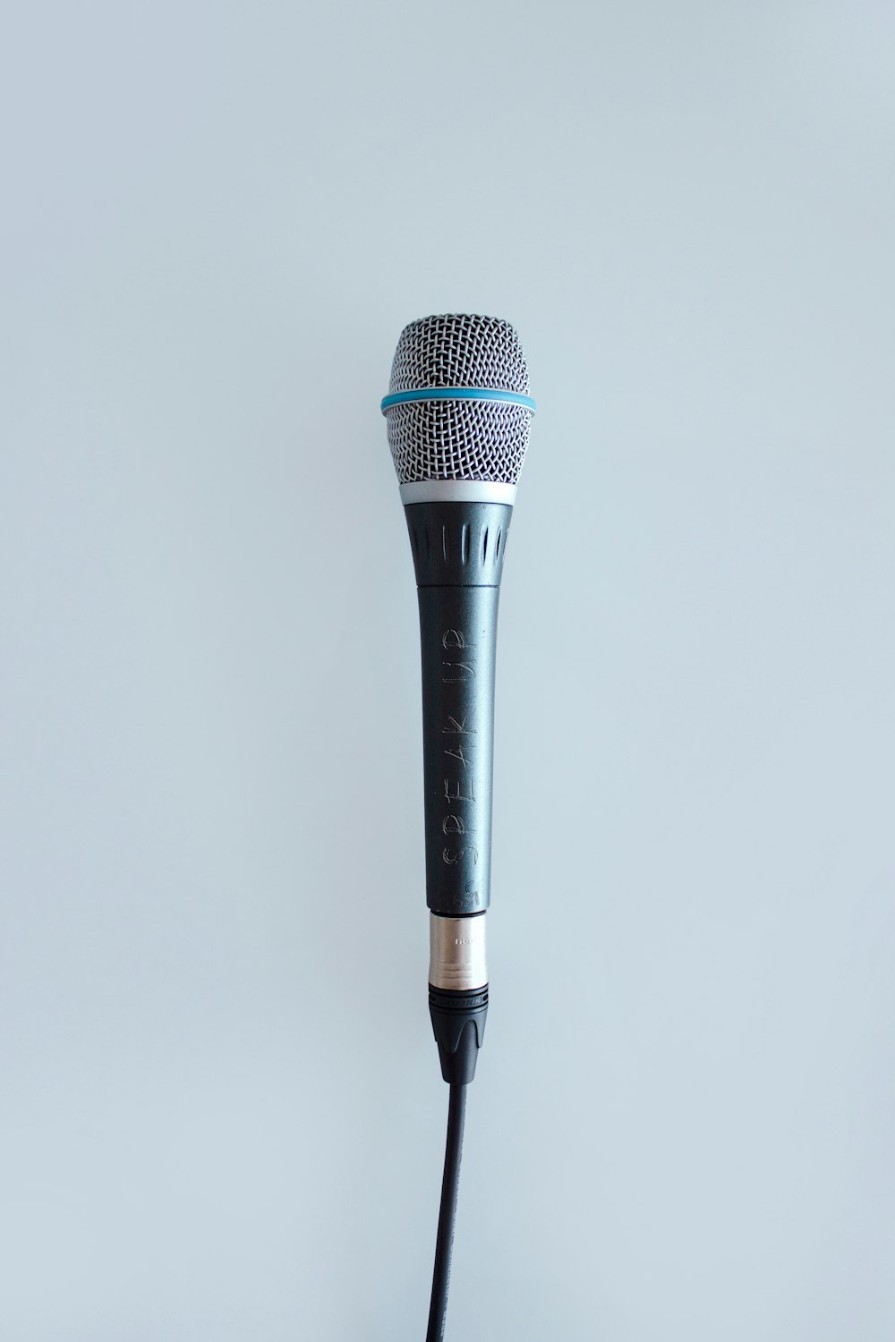 black and gray corded microphone