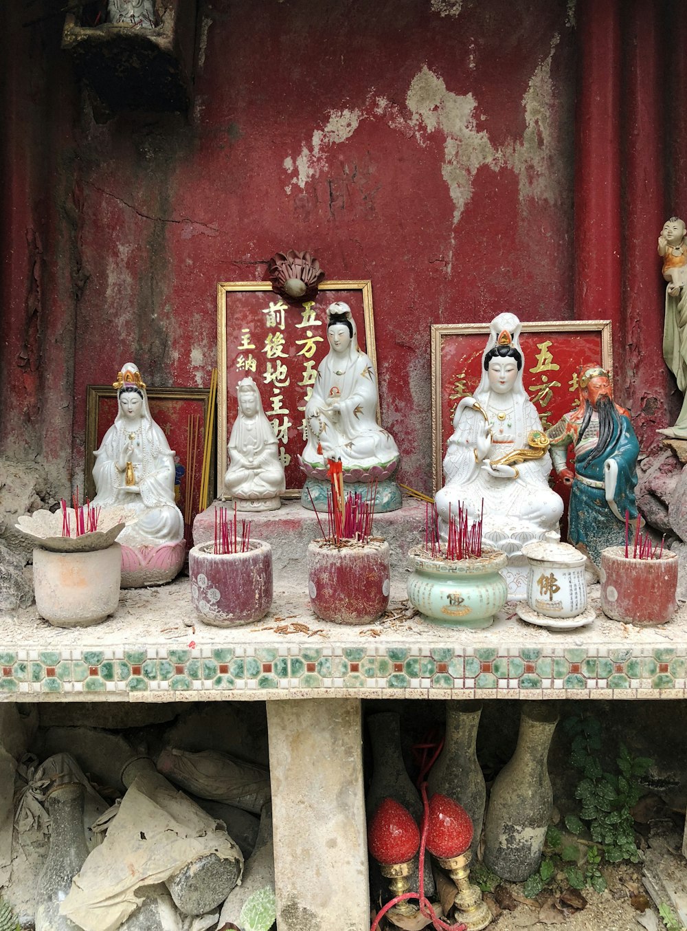 five assorted ceramic Hindu god figurines