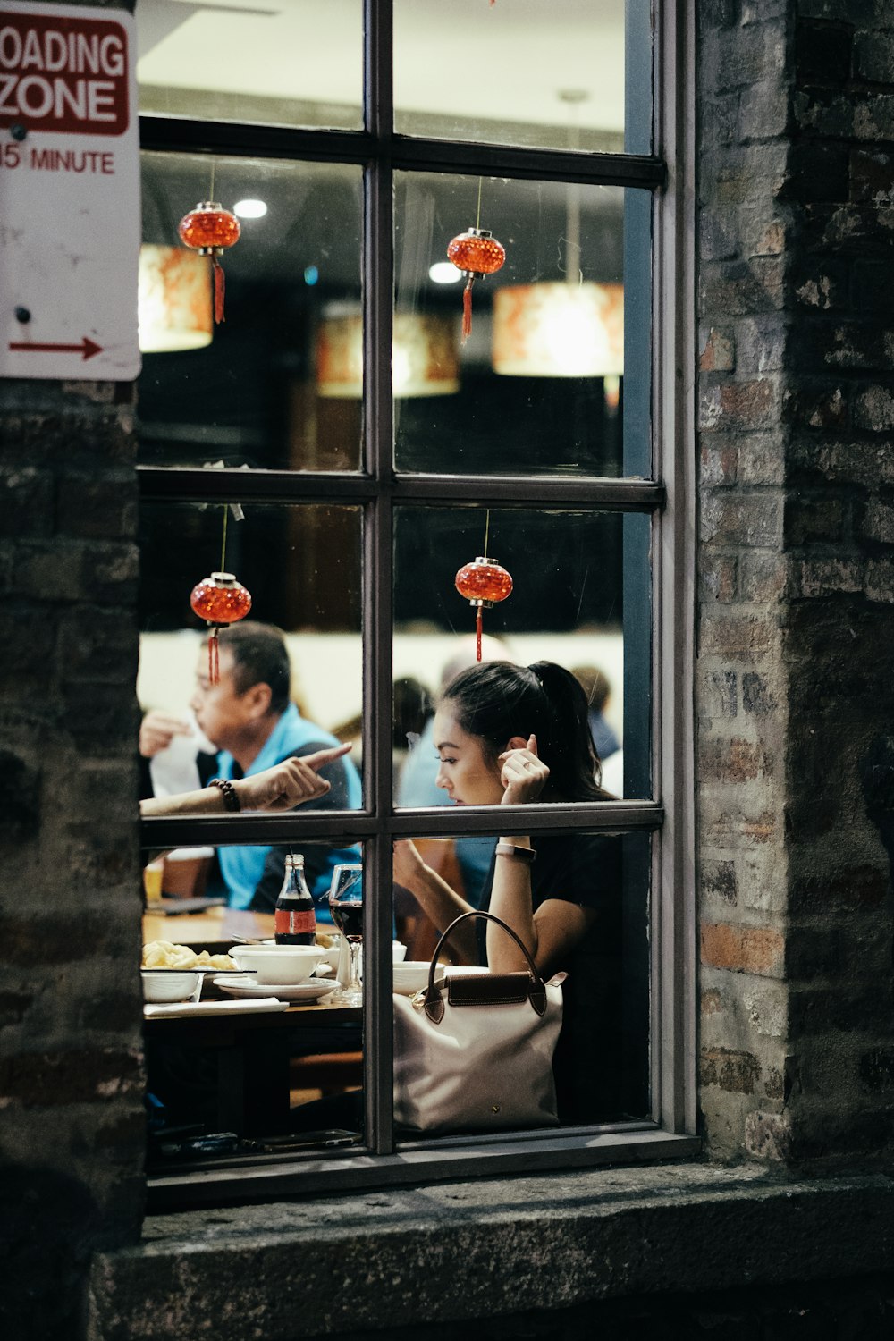 woman leaning on table