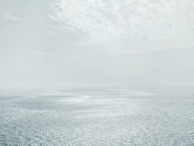 photo of empty ocean during day time serene zoom background