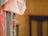 Close-up of colorful embroidered fabric draped over a wooden chair.