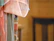 Close-up of colorful embroidered fabric draped over a wooden chair.