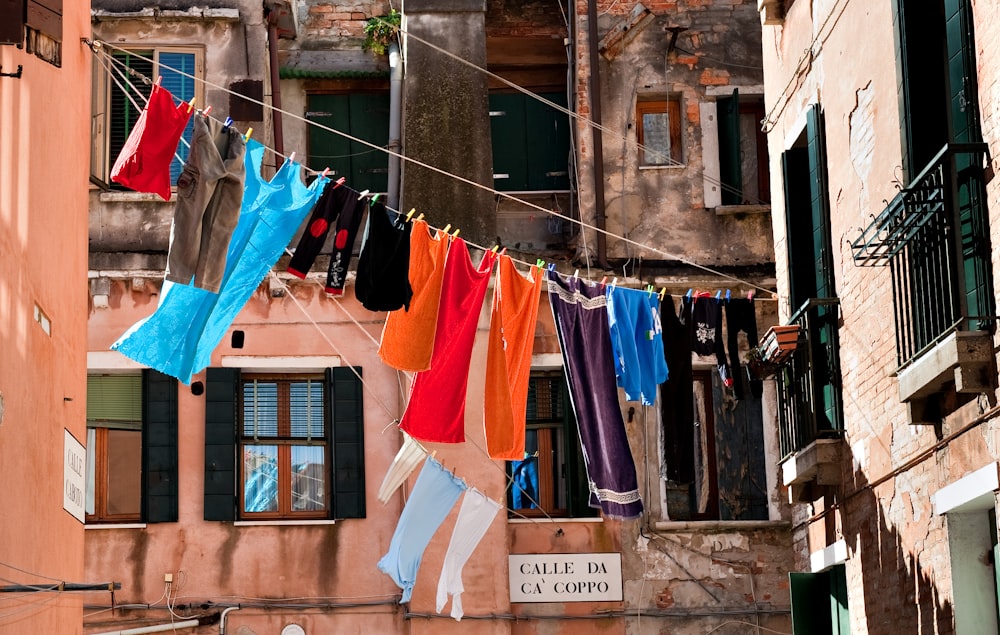 hang assorted-color clothes at daytime