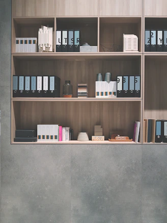 brown wooden shelf on grey wall