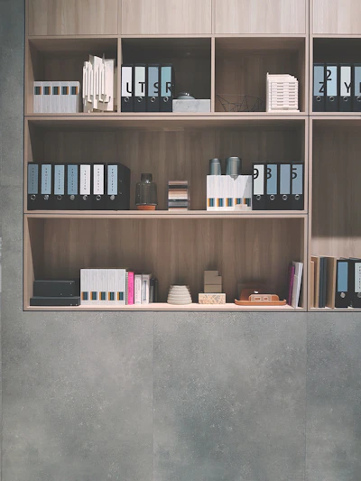 brown wooden shelf on grey wall