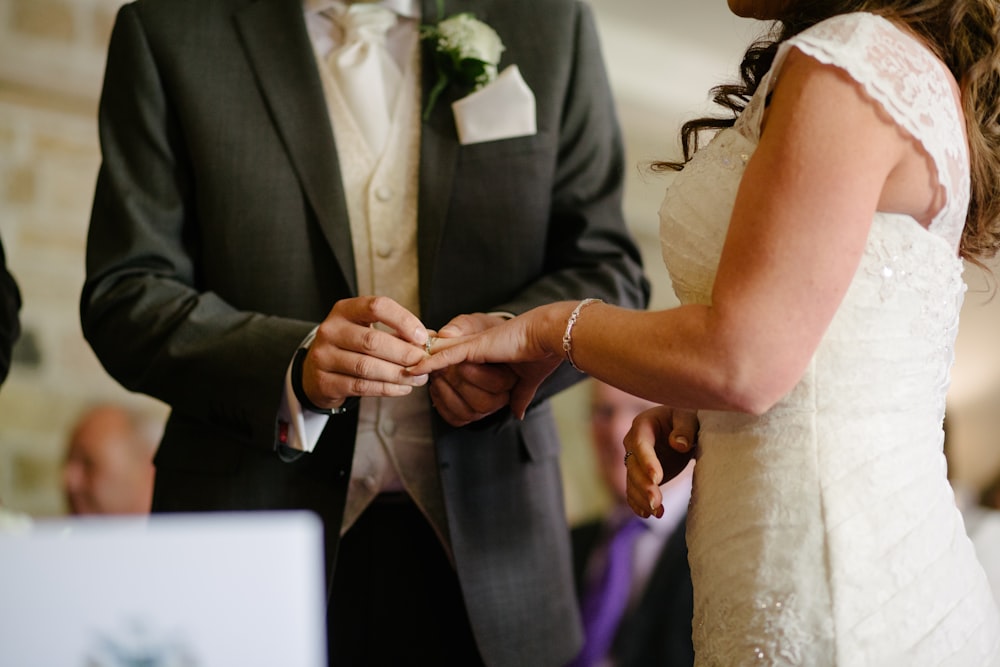 groom holding wedding