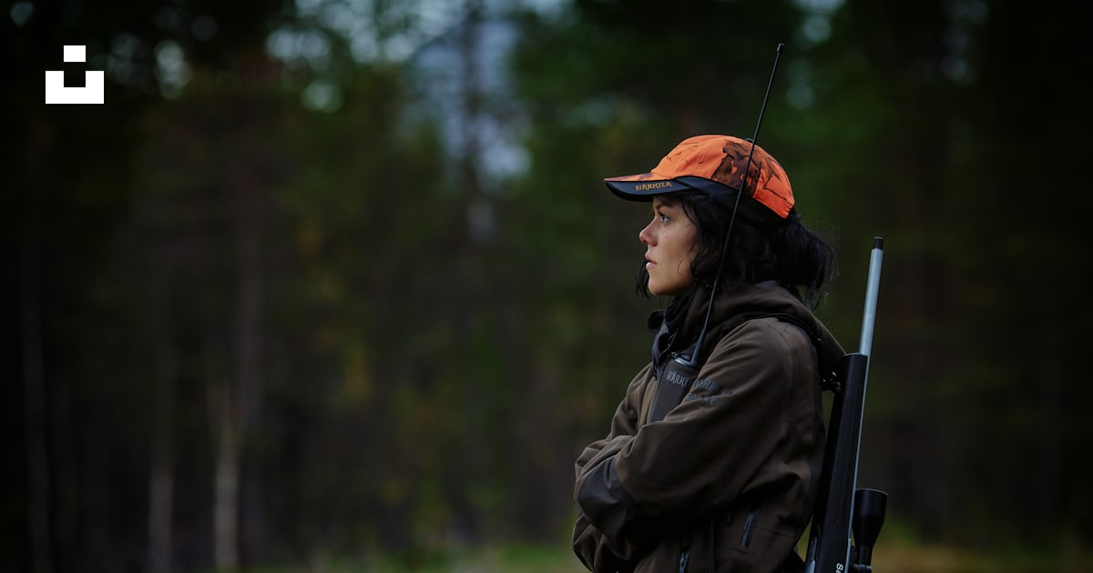 Woman carrying hunting rifle in woods photo – Free Hunting Image on ...