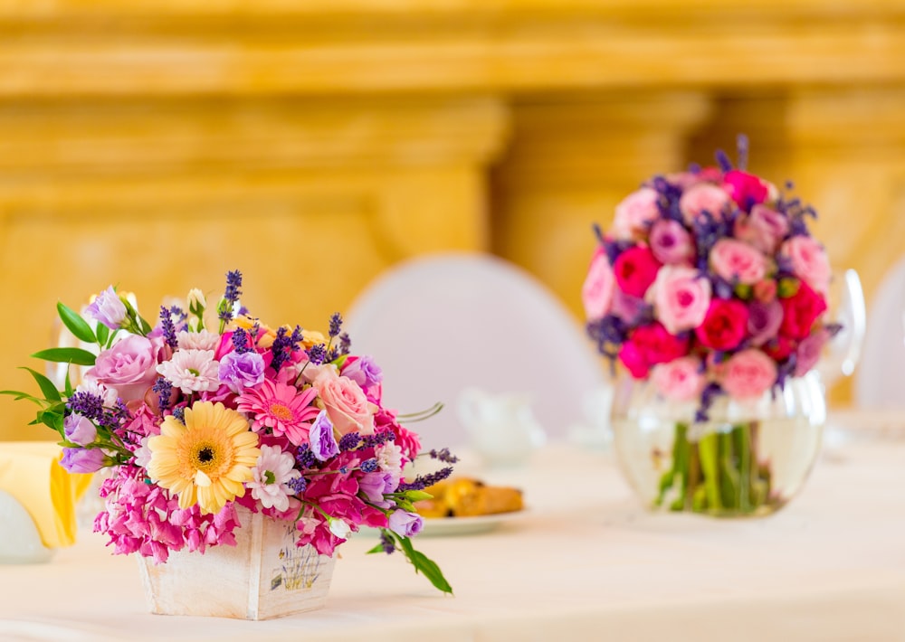 selective focus photography of assorted-color petaled flowers in vase