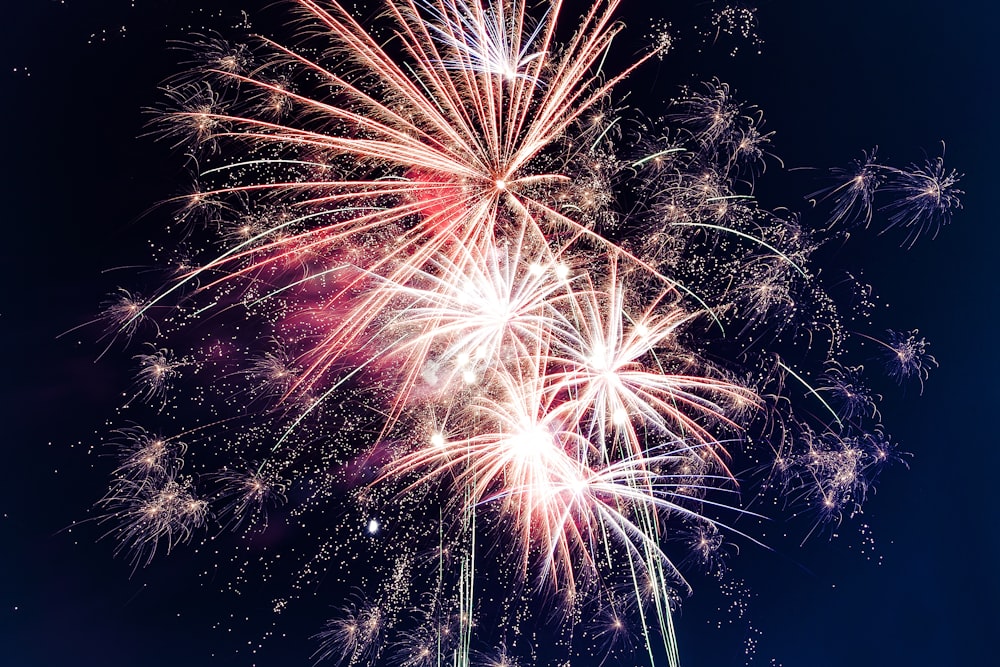 time lapse photography of fireworks at night