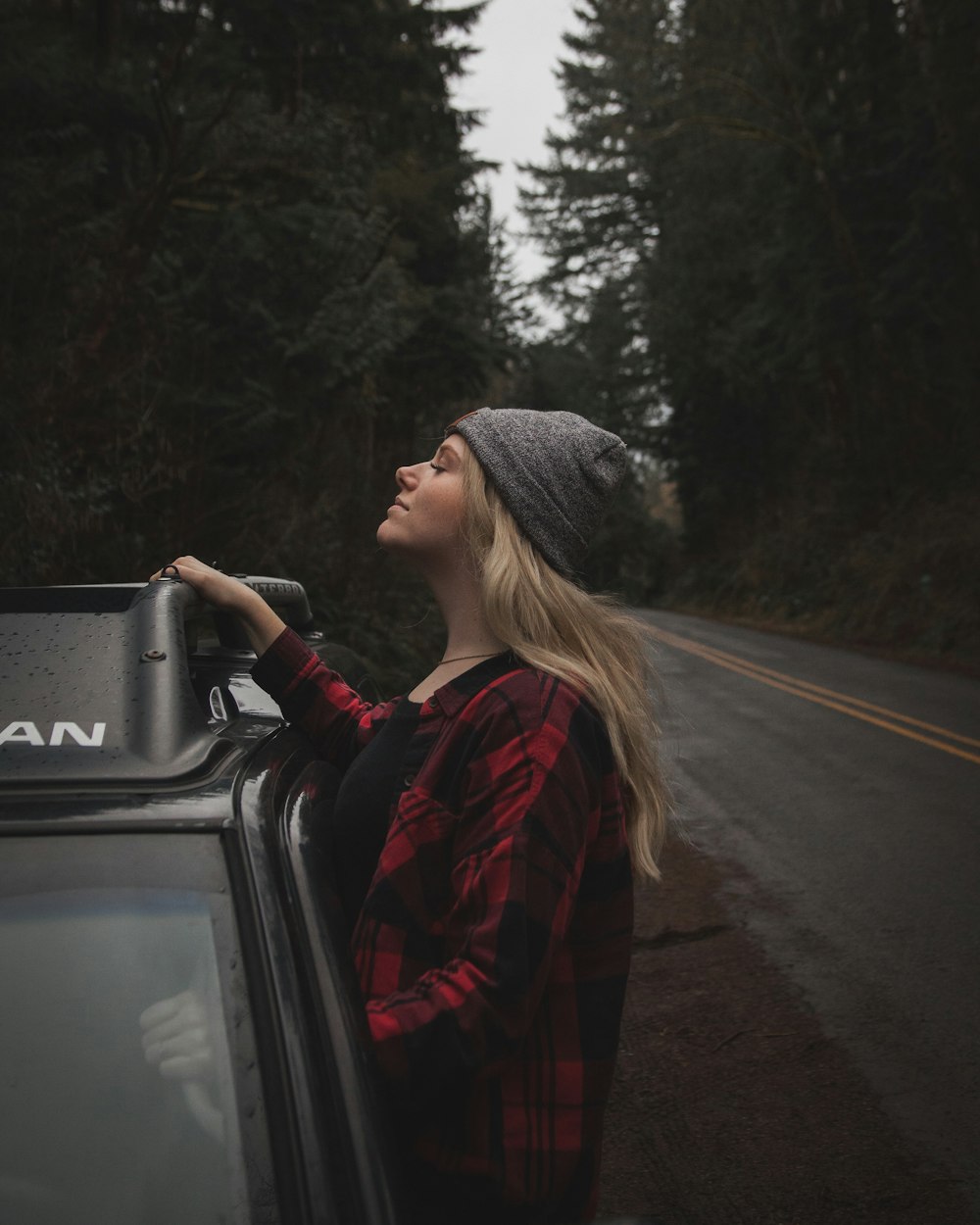 woman peeking outside vehicle