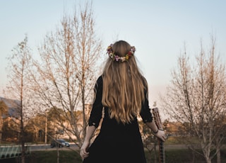 woman holding classical guitar