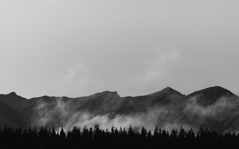 a black and white photo of a mountain range