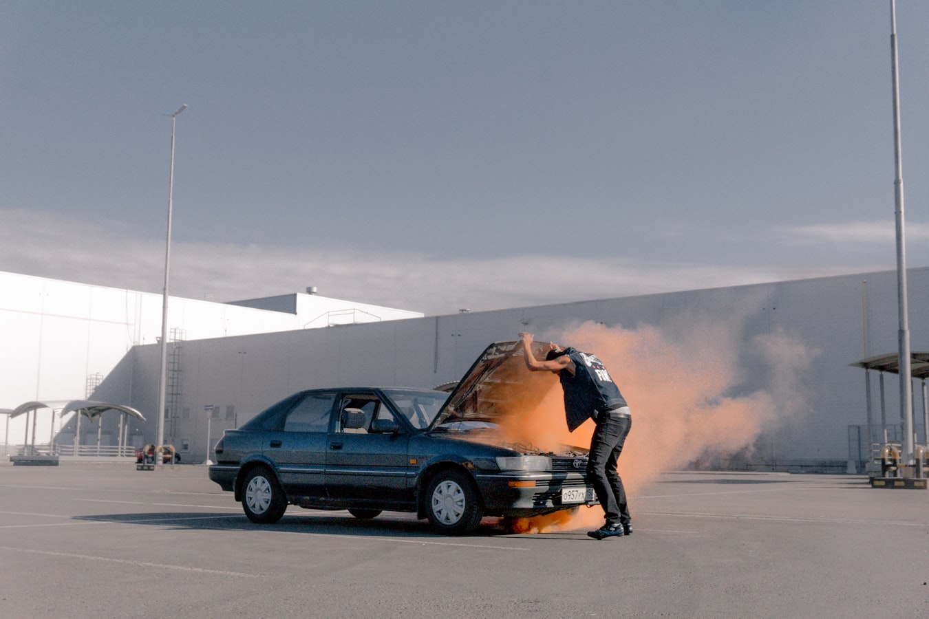 Smoke coming from under a car hood