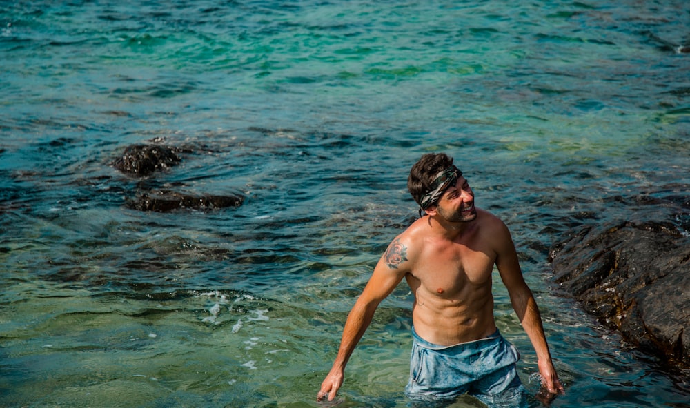 man standing in body of water