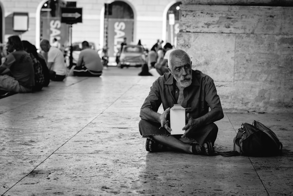 man sitting on tiles