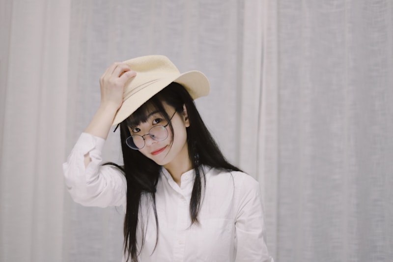 Sophisticated Japanese woman adjusting hat