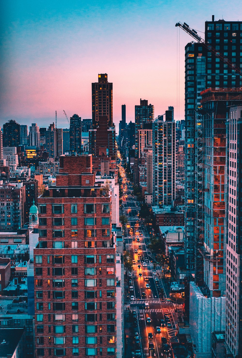 photo of high-rise buildings with blue and pink sky