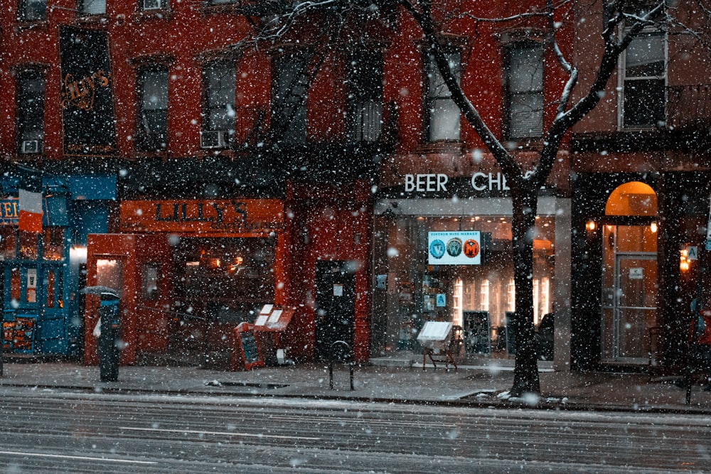 view of stores while snowing