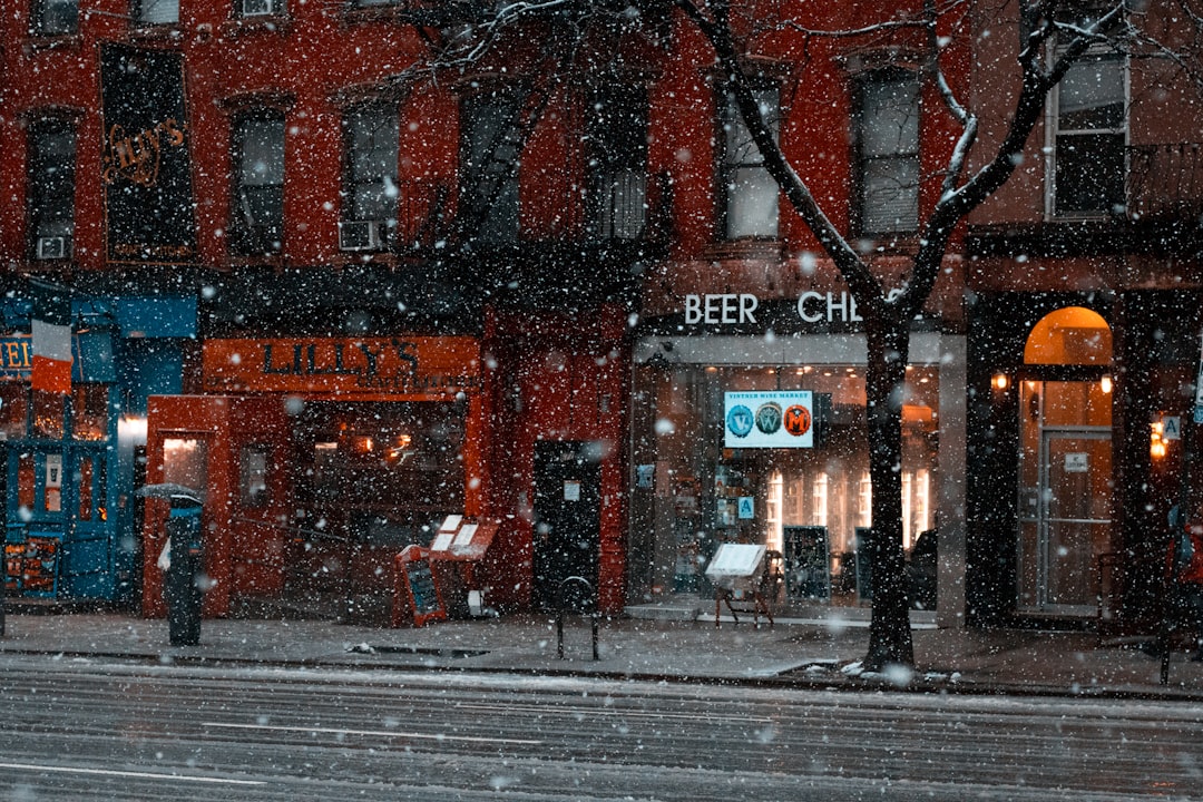 view of stores while snowing