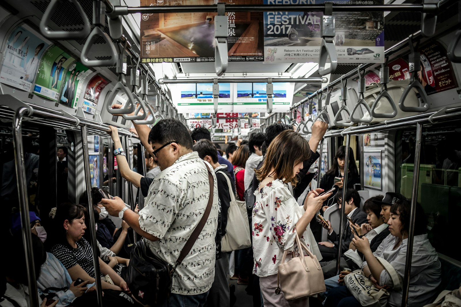 AF Nikkor 28mm f/2.8 sample photo. People inside train photography