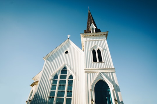 worm's-eye view photography of white and brown church in Mendocino Presbyterian Church United States