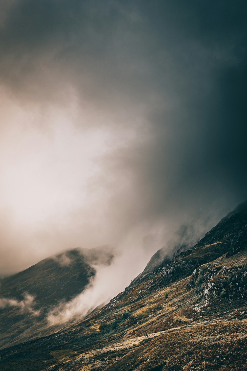 landscape photo of mountain covered with fog