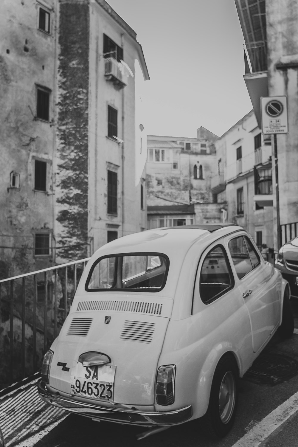 car parked beside railing in city